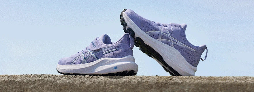 Purple ASICS kids shoes outdoors
