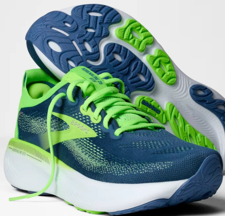 Blue and lime Brooks running shoes showing the soles