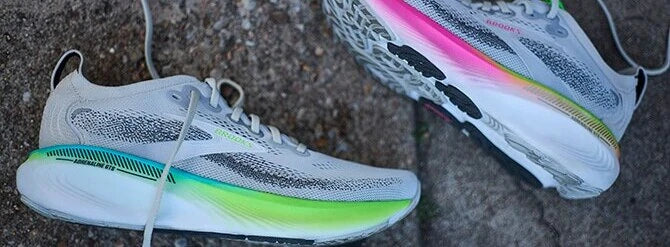 Grey Brooks running shoes with colourful sole detailing