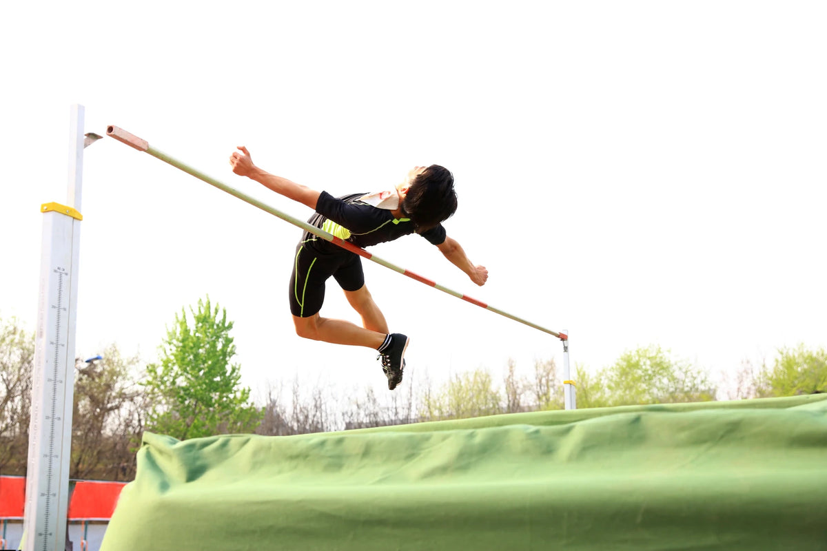 Athlete clearing a high jump bar
