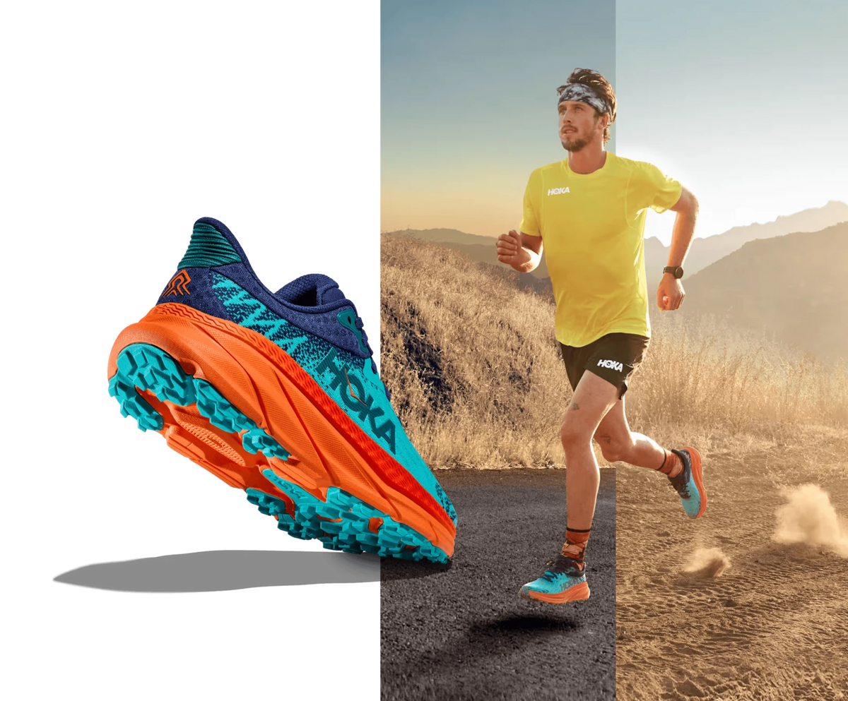 Blue and orange HOKA trail shoe beside a trail runner