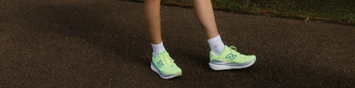 Runner wearing lime New Balance shoes outdoors