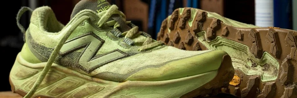 Green New Balance trail shoes showing the tread