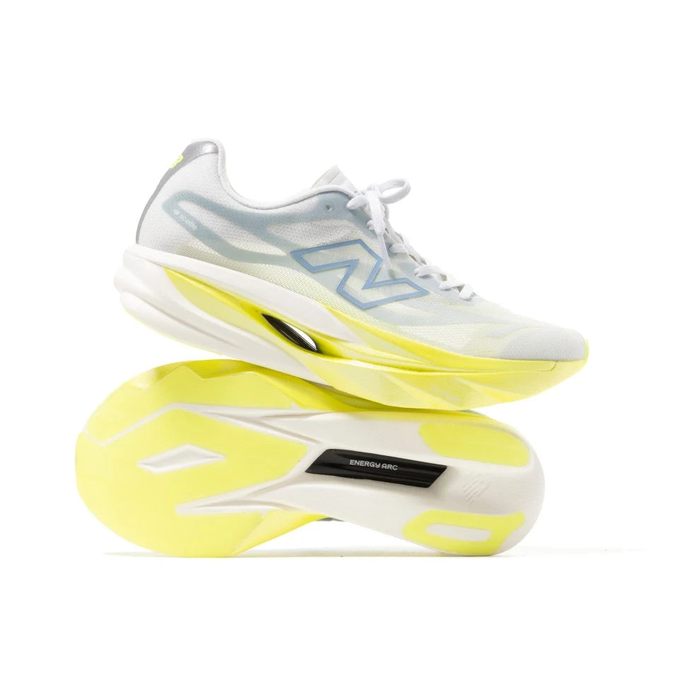 White and yellow New Balance shoes showing the sole