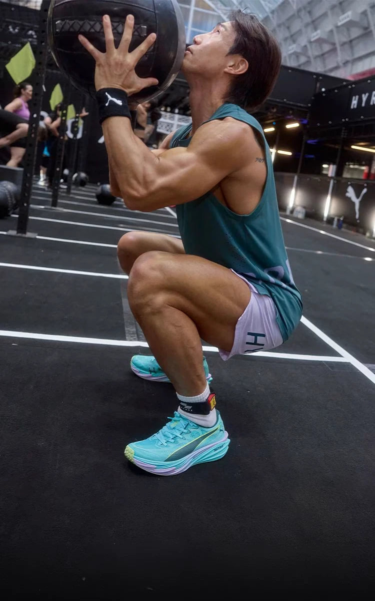 Athlete performing a wall ball exercise